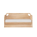 Natural oak wooden daybed with carved scalloped headboard and turned rope-style arms, minimalist Scandinavian twin bed with white mattress