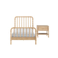 Light oak spindle bed frame with matching wooden nightstand, turned-wood twin bed and bedside table in natural finish with white bedding on a white background