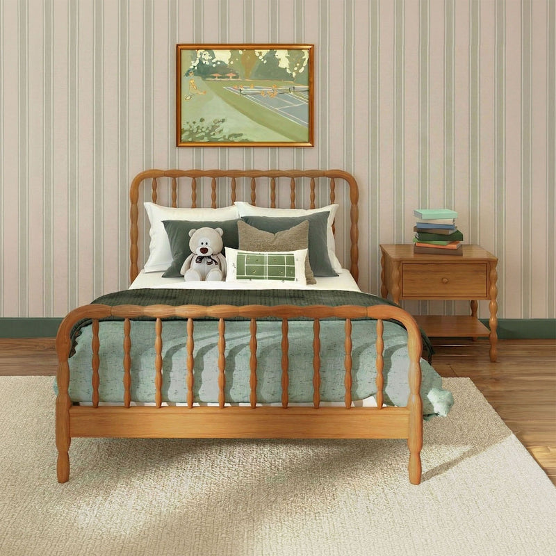 Cozy children's bedroom interior with wooden spindle bed, green bedding, teddy bear on pillows, striped wallpaper, framed painting and nightstand with stacked books