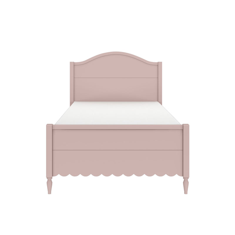 Pink wooden twin bed with arched headboard, scalloped skirt and white mattress — girls nursery or bedroom furniture