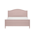 Blush pink bed frame with curved headboard and scalloped footboard, cottage-style wooden bedroom bed