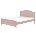 Pastel pink twin wooden bed frame with arched headboard, scalloped footboard, turned legs and white mattress, children's bedroom furniture