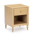 Light wood nightstand with single drawer, open cubby shelf, turned legs and scalloped apron
