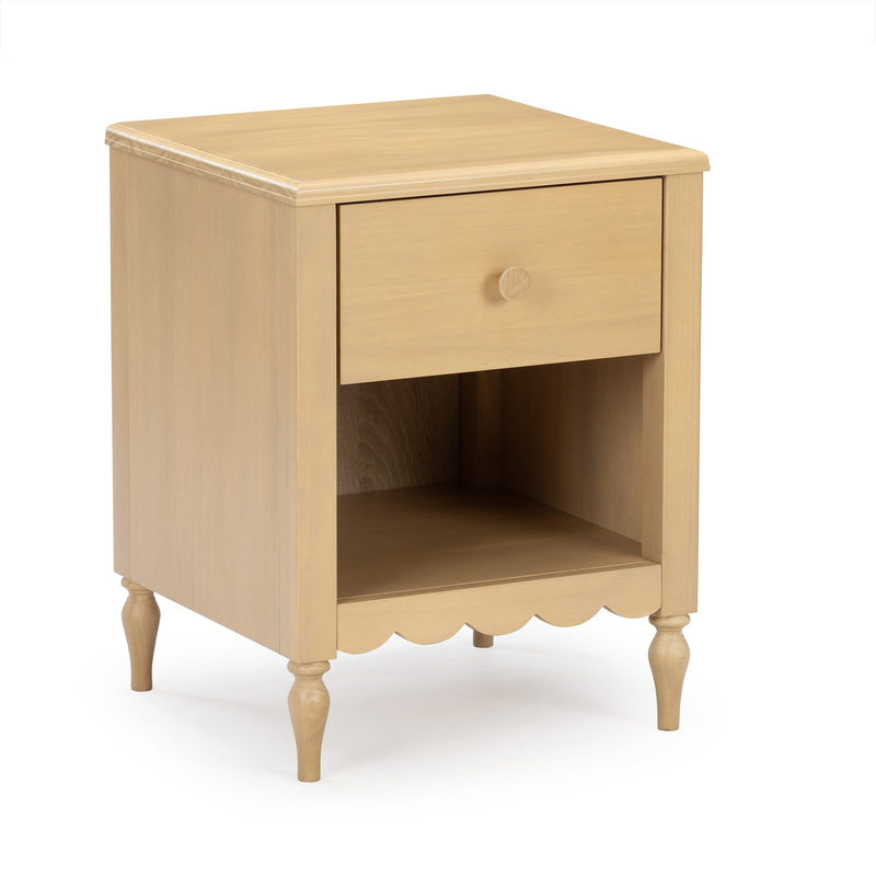 Light wood nightstand with single drawer, open cubby shelf, turned legs and scalloped apron