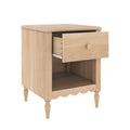 Light oak wooden bedside nightstand with single open drawer, lower shelf, turned legs and scalloped apron