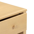 Maple wood dresser corner with partially open drawer and round wooden knob