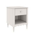 White wooden bedside nightstand with one drawer and open shelf, turned legs and scalloped apron, farmhouse-style side table