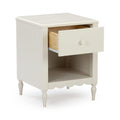White wooden bedside table nightstand with single open drawer, lower open shelf, scalloped apron and turned legs for bedroom storage