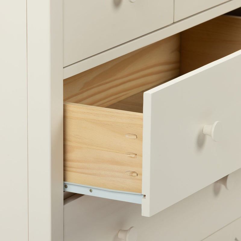 Close-up of white dresser with partially open drawer showing natural wood interior, dowel joinery and metal drawer slide.