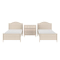 Beige wooden twin beds with scalloped headboards and matching three-drawer dresser in classic kids' bedroom set