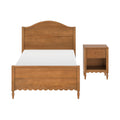 Wooden twin bed frame with arched headboard, scalloped footboard and matching bedside table in warm oak finish — traditional farmhouse bedroom furniture