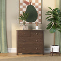 Modern home decor: dark wood dresser with green abstract wall art, potted fiddle-leaf fig, decorative vase and pencils