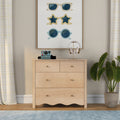 Light wood dresser with framed sunglasses wall art, gold headphone stand, vintage instant camera and potted plant in neutral bedroom decor