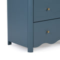Matte blue wooden nightstand with brass cone knob, scalloped base and tapered leg, modern bedroom storage