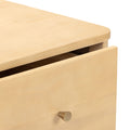 Close-up of a light maple wood dresser drawer with rounded edge and round brushed brass knob