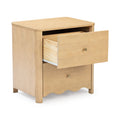 Light natural wood bedside nightstand with open drawer, brass knob, scalloped base and metal drawer slides — bedroom storage table