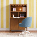 Home office nook with wall-mounted wooden desk, blue swivel chair, yellow striped wallpaper, exposed bulb lamp, books and tablet.