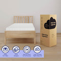 Twin memory foam mattress on a light wood bed frame beside an 8-inch twin mattress-in-a-box package with icons: unbox, unroll, 24-hour recovery, enjoy better sleep