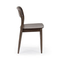 Side view of a mid-century modern walnut dining chair with curved wooden backrest and brown wooden seat on a white background