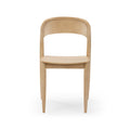 Modern Scandinavian light natural wood dining chair with curved backrest and tapered legs, front view on white background