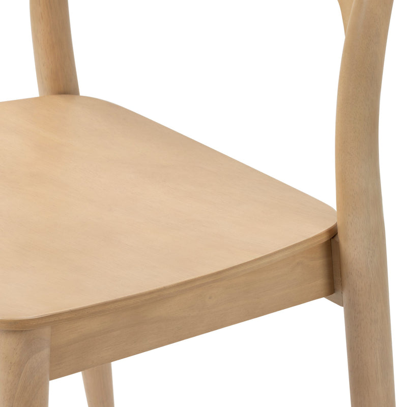 Close-up of light natural beech wood dining chair seat and rounded legs, modern Scandinavian minimalist wooden chair with smooth sanded finish
