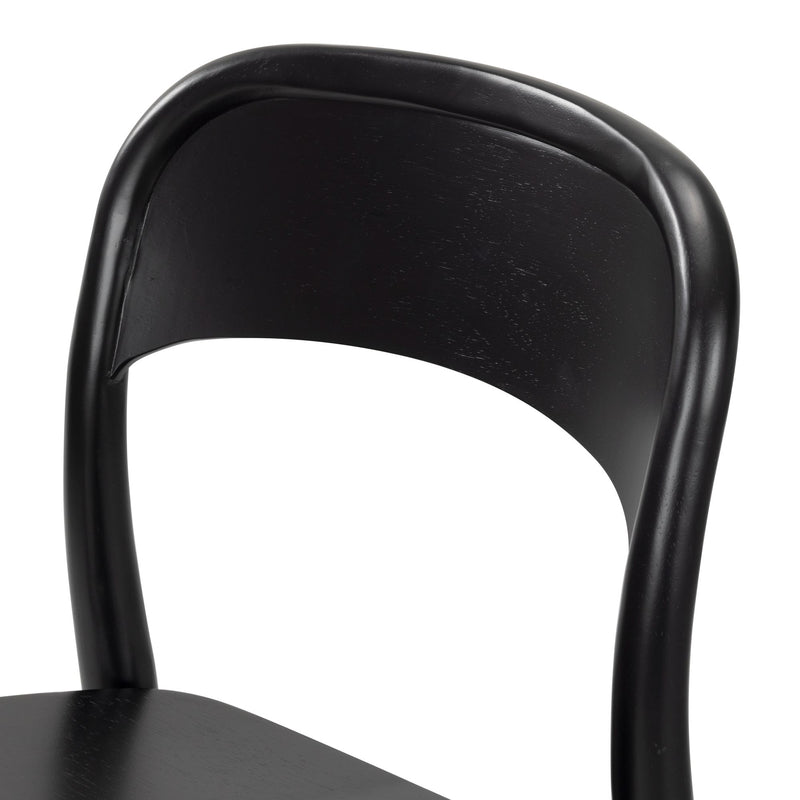 Close-up of a black bentwood dining chair showing curved backrest, smooth painted frame and visible wood grain finish