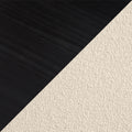 Close-up diagonal contrast of black wood flooring and beige loop carpet texture — modern hardwood and carpet flooring