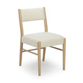 Cream boucle upholstered dining chair with padded seat and back and light oak wood frame — modern Scandinavian armless dining chair