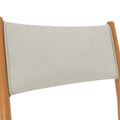 Close-up of beige boucle fabric sling chair backrest with light wood frame, modern Scandinavian mid-century design