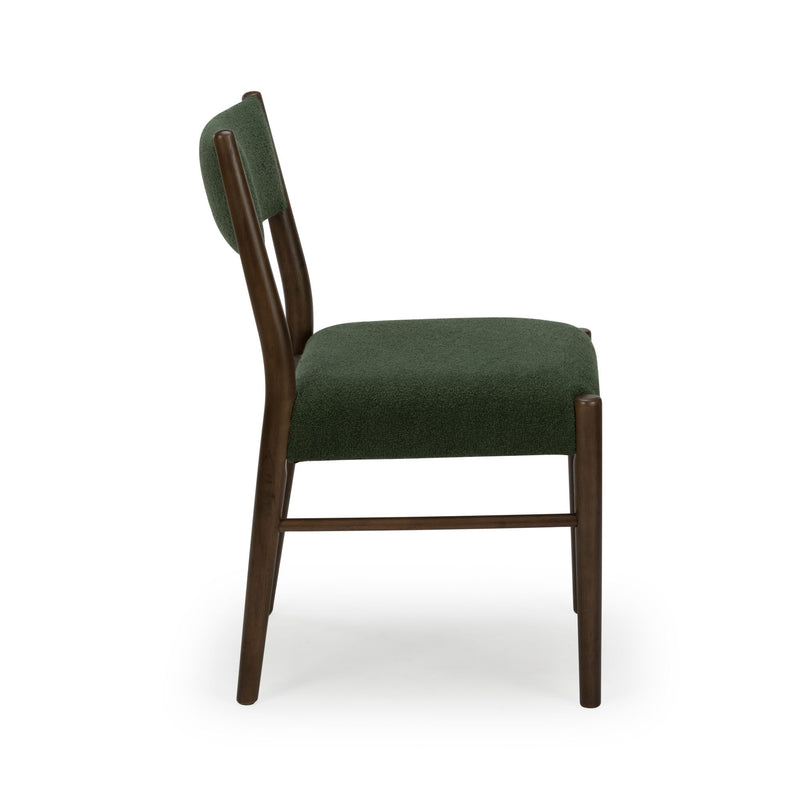 Side view of mid-century modern green upholstered dining chair with walnut wood frame and padded seat and back on white background