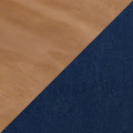 Close-up of light oak hardwood floor meeting navy blue textured carpet at a diagonal transition