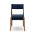 Front view of a navy upholstered dining chair with light wooden frame on a white background