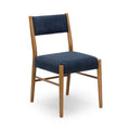 Mid-century modern dining chair with navy boucle upholstered seat and back and warm oak frame, photo on white background