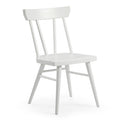 White wooden spindle-back dining chair with contoured seat and angled legs, Scandinavian farmhouse style, isolated on white background