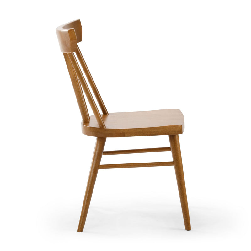 Mid-century modern light oak wooden dining chair with spindle back, side view isolated on white background
