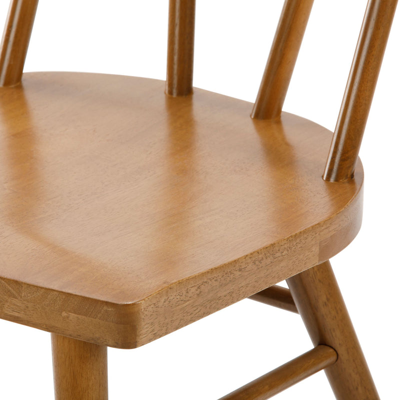 Close-up of natural wood dining chair seat and spindle backrest in warm oak finish — solid wood mid-century modern farmhouse chair