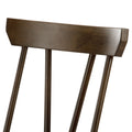 Close-up of dark walnut wooden dining chair back with rectangular top rail and three vertical spindle slats, smooth finish