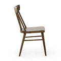 Mid-century modern walnut wood dining chair with angled spindle back and tapered legs on white background