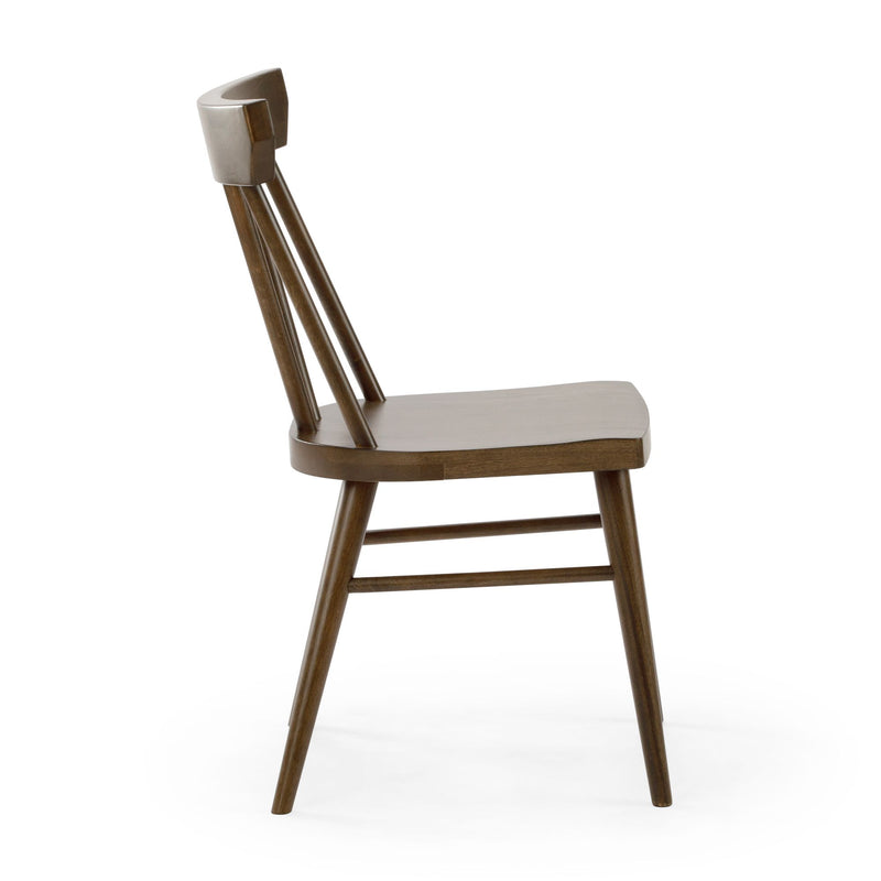 Mid-century modern walnut wood dining chair with angled spindle back and tapered legs on white background
