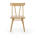 Minimalist Scandinavian light beech wood dining chair with spindle back and tapered legs on white background
