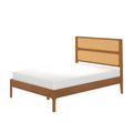 Mid-century modern wooden platform bed with woven rattan cane headboard and white mattress