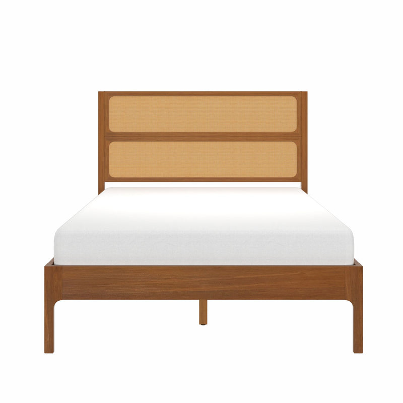 Mid-century modern walnut bed frame with woven cane headboard and white mattress, front view