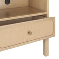 Light wood mid-century modern nightstand with woven cane drawer front, brass knob, open shelf and built-in power outlet with USB ports
