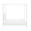 White modern four‑poster canopy bed frame with white mattress, minimalist platform bed for bedroom decor
