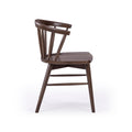 Dark brown solid wood spindle-back dining chair with curved backrest and contoured seat, mid-century modern style