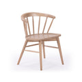 Solid light wood spindle-back dining chair with curved armrest and tapered legs, Scandinavian modern design