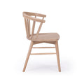 Modern Scandinavian spindle-back wooden dining chair in light natural wood finish with rounded backrest and tapered legs on white background