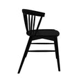 Matte black wooden Windsor dining chair side profile with spindle back and contoured seat — modern farmhouse seating