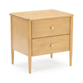 Mid-century modern light wood two-drawer nightstand bedside table with brass knobs and tapered legs
