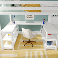 White loft bed with built-in desk and workspace, green striped bedding and yellow throw, laptop, Rubik’s Cube and blue pen cup against a mint-green wall